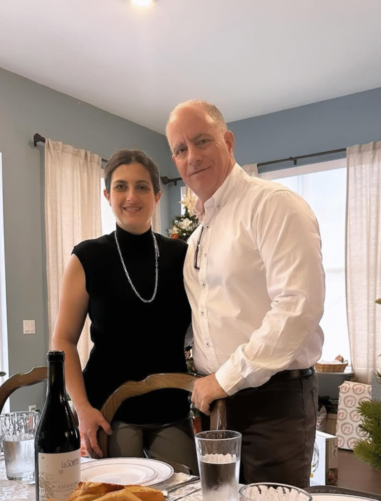 Eric Cavallaro, owner of Pepe & Sale restaurant in Stuart, Florida, standing inside the dining room, smiling warmly.